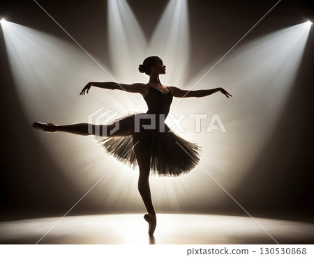 Silhouette of ballerina in graceful dance pose with glowing spotlight, cinematic elegant stage scene Silhouette of ballerina in graceful dance pose with glowing spotlight, cinematic elegant stage scene 130530868