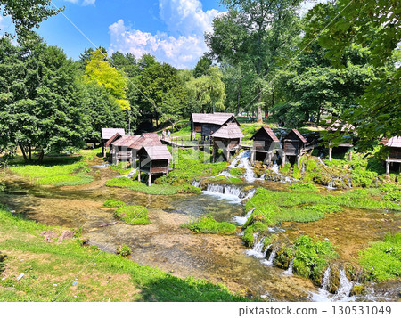A group of disused mini wooden watermills (known as Mlincici) located on Pliva Lake (Plivska Jezera) near Jajce, Bosnia and Herzegovina A group of disused mini wooden watermills (known as Mlincici) located on Pliva Lake (Plivska Jezera) near Jajce, Bosnia and Herzegovina 130531049