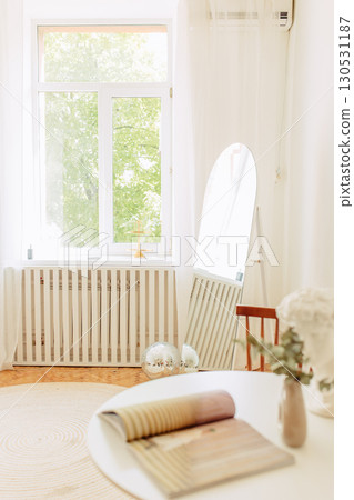Interior of light living room with sofas, rattan table and soft carpet Interior of light living room with sofas, rattan table and soft carpet 130531187