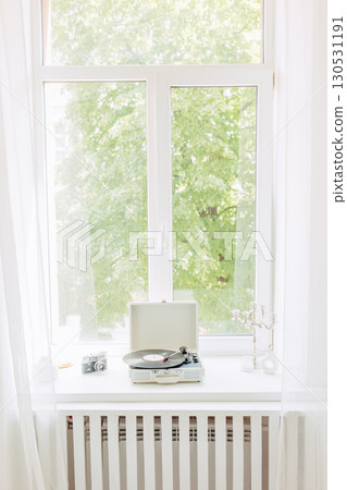 Interior of light living room with sofas, rattan table and soft carpet Interior of light living room with sofas, rattan table and soft carpet 130531191