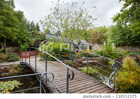 Lush garden and water feature Lush garden and water feature 130531375