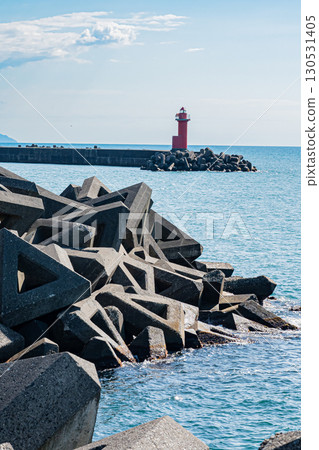 View of the sea and red lighthouse at Onishi Twin Beach in Hokkaido (clear summer weather) View of the sea and red lighthouse at Onishi Twin Beach in Hokkaido (clear summer weather) 130531405
