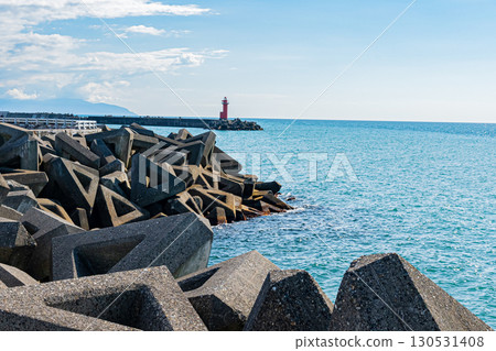 View of the sea and red lighthouse at Onishi Twin Beach in Hokkaido (clear summer weather) 130531408
