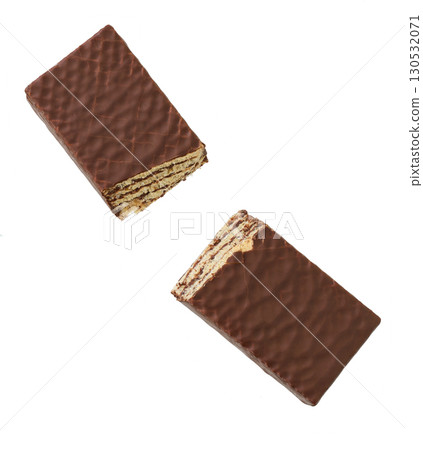 chocolate wafer broken into two pieces isolated on white background. Top view. chocolate wafer broken into two pieces isolated on white background. Top view. 130532071