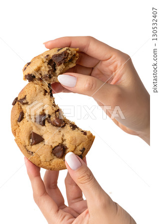 Hands breaking apart freshly baked chocolate chip cookie, warm gooey dessert isolated on transparent background Hands breaking apart freshly baked chocolate chip cookie, warm gooey dessert isolated on transparent background 130532407