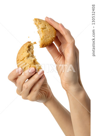 Close-up of hands snapping cookie in half, homemade dessert concept Close-up of hands snapping cookie in half, homemade dessert concept 130532408