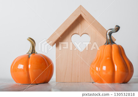 Minimalist Wooden House and White Pumpkins Autumn Home Decor Minimalist Wooden House and White Pumpkins Autumn Home Decor 130532818
