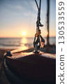 Detail of sailboat in the morning sun at the sea 130533559