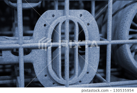 Object printed on 3D printer from molten plastic powder close-up. Model printed on 3D printer from melted polyamide powder. New modern additive 3D printing technology. Multi Jet Fusion MJF technology 130535954