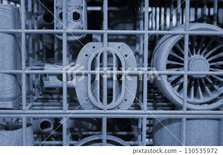Object printed on 3D printer from molten plastic powder close-up. Model printed on 3D printer from melted polyamide powder. New modern additive 3D printing technology. Multi Jet Fusion MJF technology 130535972