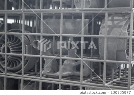 Object printed on 3D printer from molten plastic powder close-up. Model printed on 3D printer from melted polyamide powder. New modern additive 3D printing technology. Multi Jet Fusion MJF technology 130535977
