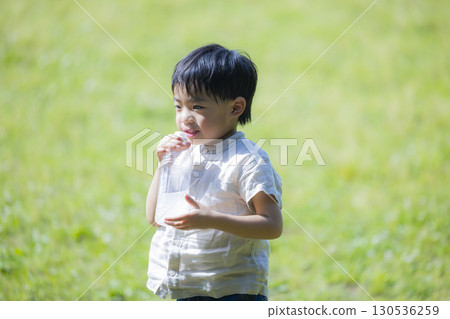 Child drinking a plastic bottle drink Child drinking a plastic bottle drink 130536259