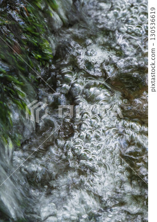 bubbles flowing through the clear stream 130536619