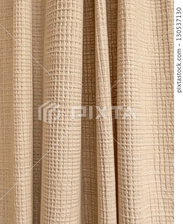 Textured Beige Fabric Curtain With Vertical Folds and Neutral Color Scheme 130537130