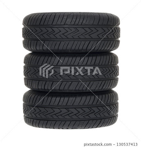 A stack of four black car tires is neatly arranged, showcasing their tread patterns. tires are aligned vertically, emphasizing their uniformity and design, suitable for automotive use 130537413