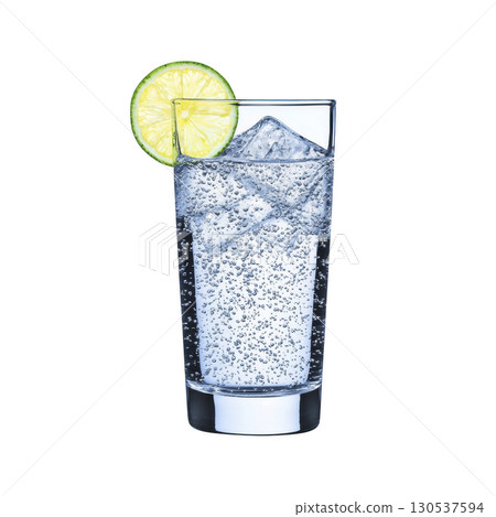 A refreshing glass of sparkling water with ice cubes and slice of lime, perfect for cool and invigorating drink. bubbles add lively touch to clear beverage 130537594