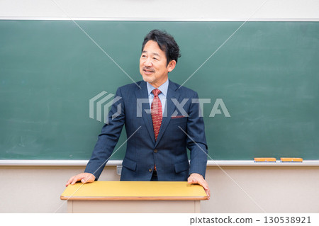 A kind-looking male teacher 130538921