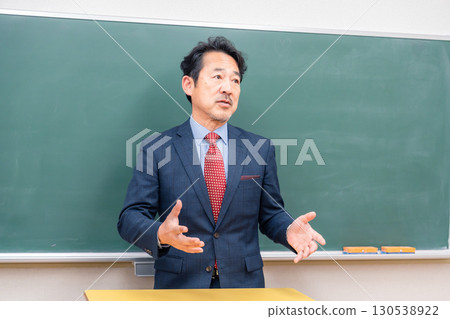 A kind-looking male teacher 130538922