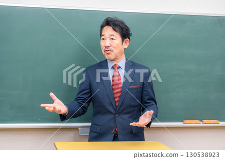 A kind-looking male teacher 130538923