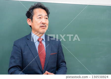 A kind-looking male teacher 130538924