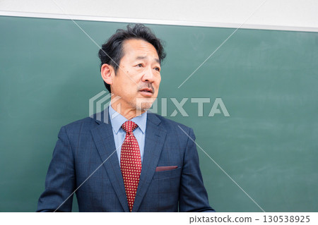 A kind-looking male teacher 130538925
