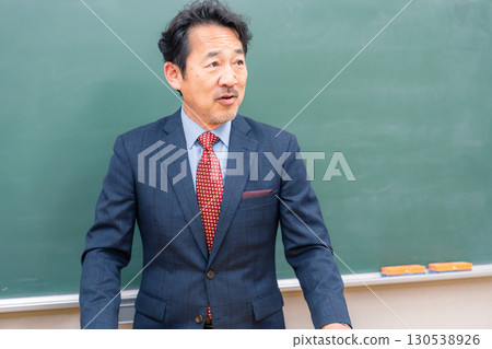 A kind-looking male teacher 130538926