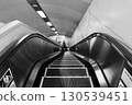 Subway entrance: Long escalator leading down "Sapporo Subway Shin-Sapporo Station" black and white 130539451