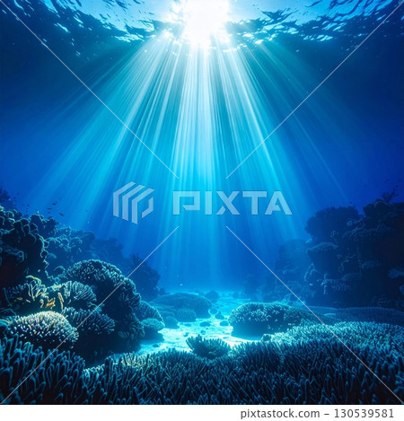 Sun Rays Shining Through Deep Blue Ocean Waters illuminating Coral Reefs 130539581