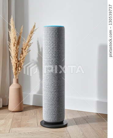 Gray Smart Speaker on Wooden Floor with Vase and White Wall Background 130539737