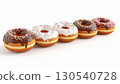 Five Ring Doughnuts with Chocolate and White Icing on Bright Background 130540728