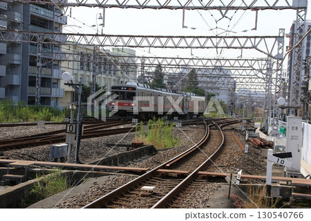 A Tokyu Tamagawa Line train heading towards Kamata Station 130540766