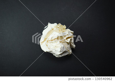round lump paper on black background, recycle used paper 130540962
