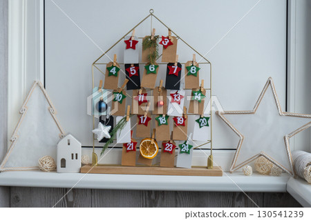 Step by step instruction of making handmade Christmas advent calendar. Creative craft homemade decor. New year celebration. Winter 130541239