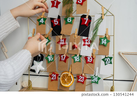 Traditional twenty four days advent calendar before Christmas holidays. Plastic free zero waste sustainable decoration. Winter cozy home Catholic traditions of Christmas countdown new year 130541244