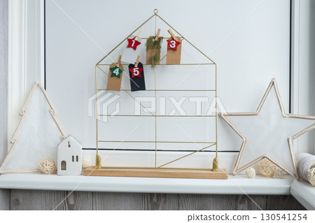 Traditional twenty four days advent calendar before Christmas holidays. Plastic free zero waste sustainable decoration. Winter cozy home Catholic traditions of Christmas countdown new year Traditional twenty four days advent calendar before Christmas holidays. Plastic free zero waste sustainable decoration. Winter cozy home Catholic traditions of Christmas countdown new year 130541254