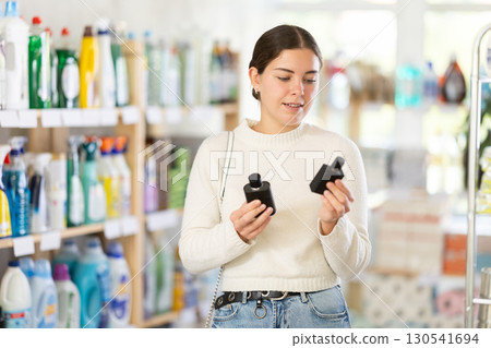 woman chooses a perfume woman chooses a perfume 130541694