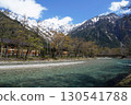 A view of the Azusa River with the snow-capped Hodaka Renzan mountain range visible on a clear day in Kamikochi 130541788