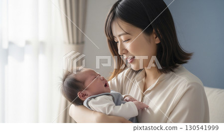 Mother holding a newborn baby 130541999
