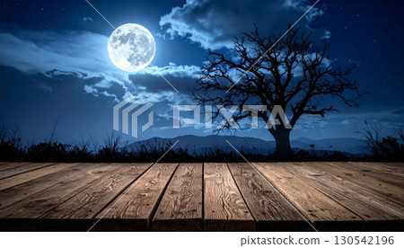 Full moon and bright stars illuminate a dark night sky over a misty blue forest and the sea 130542196