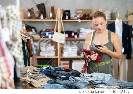 customer scans a barcode on a bag in a store customer scans a barcode on a bag in a store 130542392