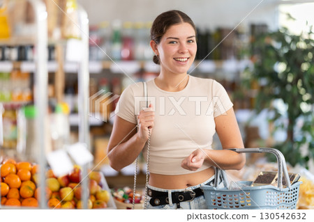 Young woman choosing food in grocery store Young woman choosing food in grocery store 130542632