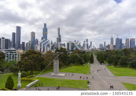 Melbourne, Australia - December 30,2023 : The park pathway leading into the heart of the city looking from the Shrine of Remembrance in Melbourne, Australia on December 30,2023. 130543135