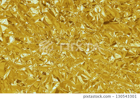 Gold foil leaf shiny texture, abstract yellow wrapping paper for background and design art work. 130543301