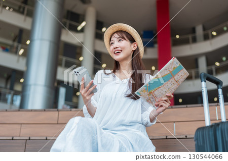 A woman planning a trip 130544066