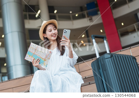 A woman planning a trip 130544068