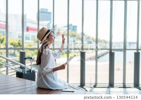 Young woman traveling 130544114