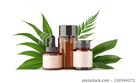Natural skincare product arrangement with glass bottles and green leaves on white background 130544273