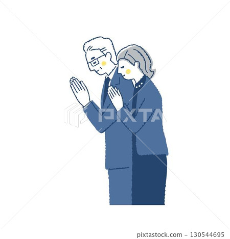 身著喪服的男女一起祈禱 身著喪服的男女一起祈禱 130544695