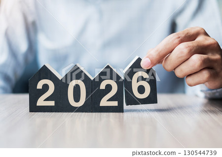 Businessman hands holding 2026 Happy New Year with house model on table office. New House, Financial, Property insurance, real estate, savings and New Year Resolution concepts Businessman hands holding 2026 Happy New Year with house model on table office. New House, Financial, Property insurance, real estate, savings and New Year Resolution concepts 130544739