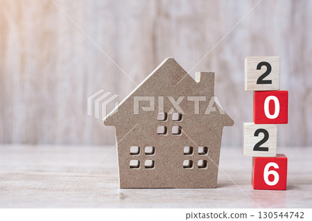 2026 Happy New Year with house model on table wooden background. Banking, real estate, investment, financial, savings and New Year Resolution concepts 2026 Happy New Year with house model on table wooden background. Banking, real estate, investment, financial, savings and New Year Resolution concepts 130544742